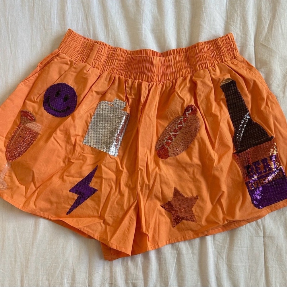 QUEEN OF SPARKLES Orange Sequin Graphic Shorts